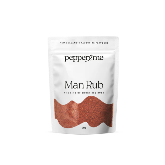 A 70g stand-up pouch of pepper2me Man Rub BBQ rub in a white packaging with a wavy reddish-brown graphic representing the spice blend, on a white background.