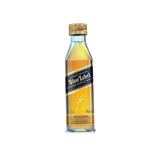A miniature bottle of Johnnie Walker Blue Label whisky, with a clear label and a gold-colored cap and bottle neck.