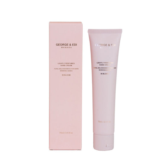 Pink hand cream tube and packaging with 'George & Edi' branding on a white background